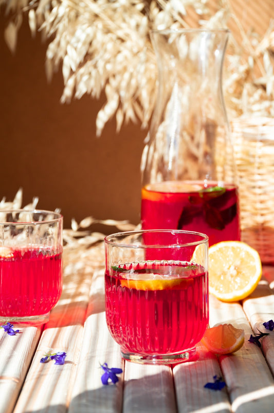 Glasses of hibiscus and rooibos ice tea